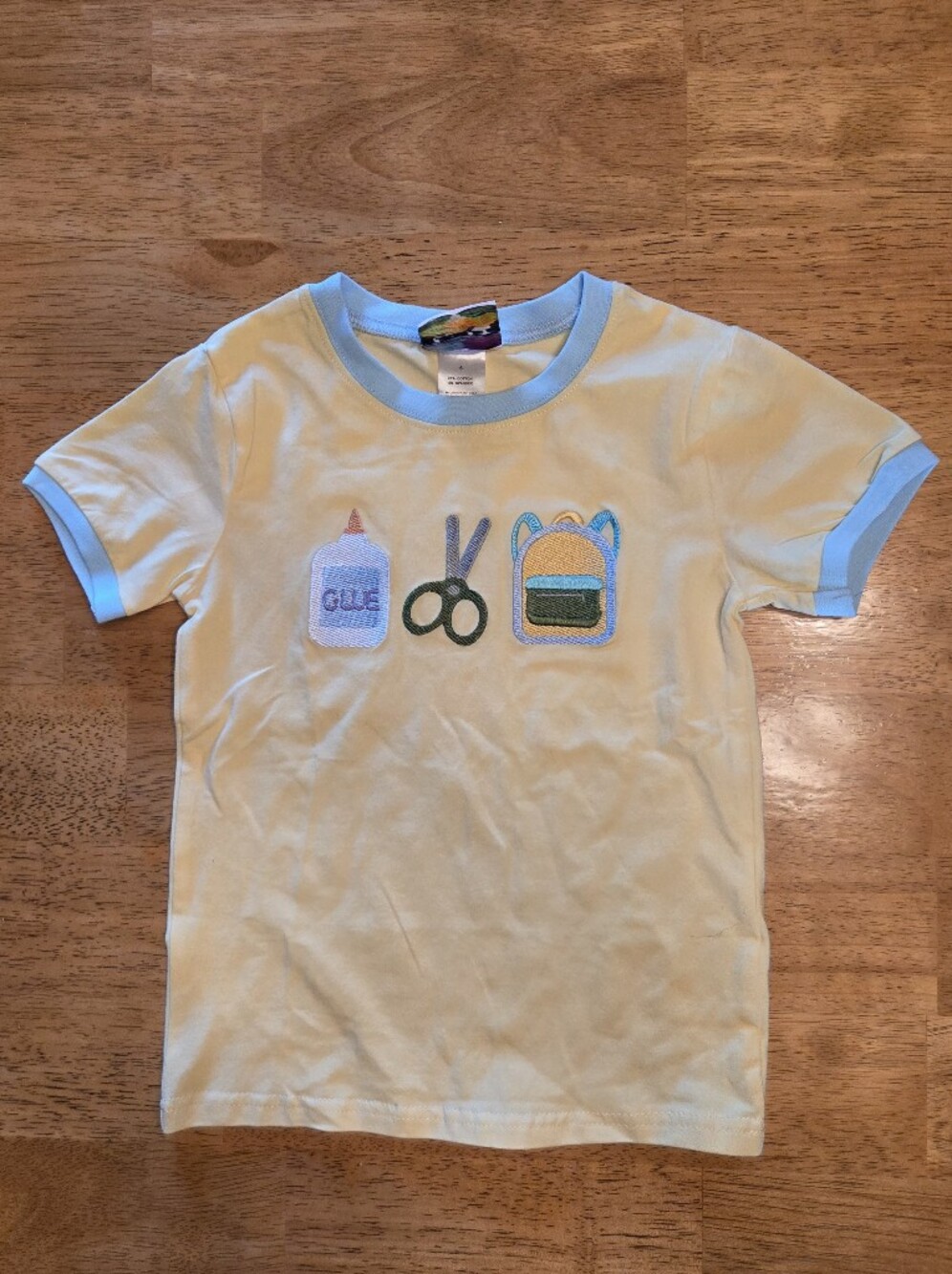 Kids Yellow Short Sleeve Tee with Blue Trim and School Icons